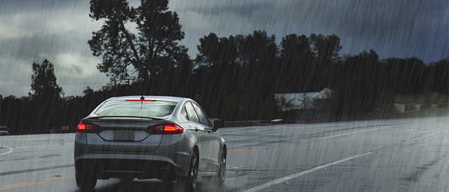 Staying alert while driving is particularly important and more so in situations when your vision is partially obstructed while driving in the rain. Keep both hands on the wheel at all times.