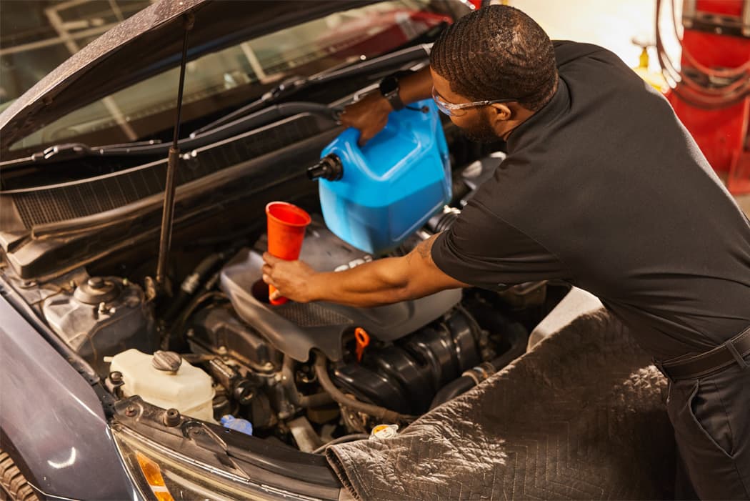 oil change frequency - mavis tech changing oil