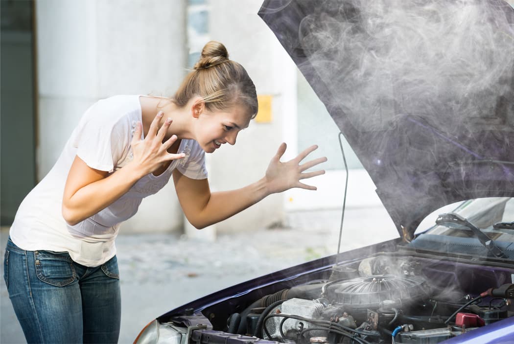frustrated driver smoking engine